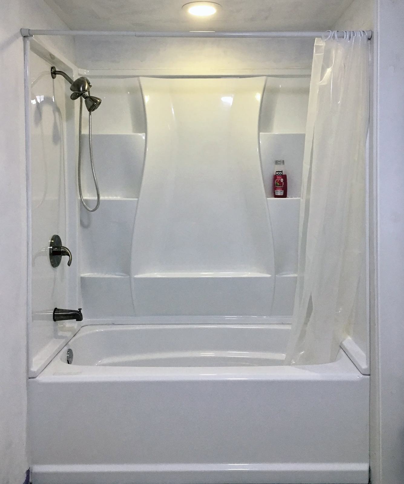 White tub and shower surround